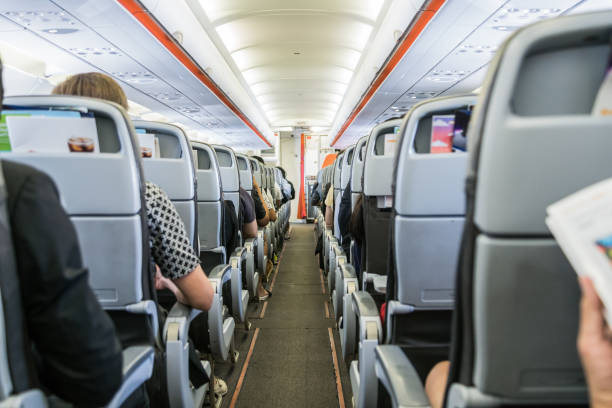 airplane with passengers on seats waiting to take off airplane with passengers on seats waiting to take offairplane with passengers on seats waiting to take off vehicle seat stock pictures, royalty-free photos & images
