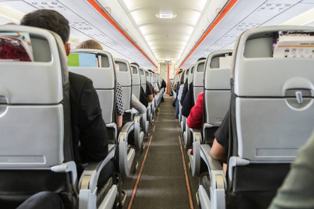 istock airplane with passengers on seats waiting to take off 641458934