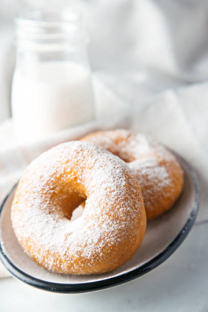 istock Sweet donuts with sugar and milk 641463120
