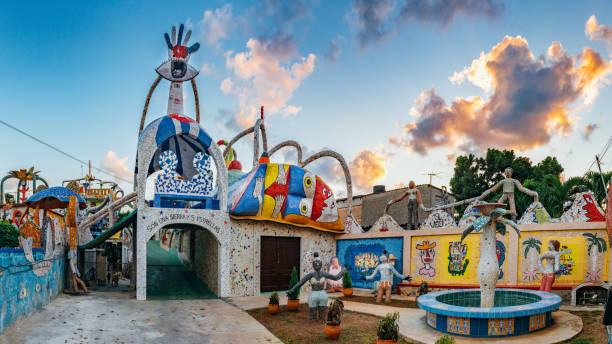 Exterior views of José Fuster workshop and residence in Havana. José Fuster is Cuban Artist who inspired by Antonio Gaudi's style built his studio house with mosaic, his style soon spread though the neighborhood leaving many houses decorated the same way. Converting a poor community into a tourist attraction known as Fusterlandia.