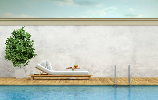 istock Swimming pool with chaise lounge 641473494
