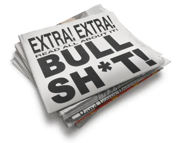 A stack of news papers with the headline proclaiming "Bull Sh*t!" isolated on a white background.