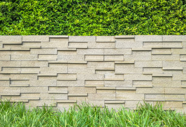 istock Home and garden decoration, grass and stone wall backround 641477202