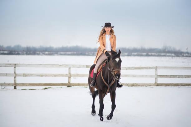 istock Woman enjoying winter breaks with her horse 641482848