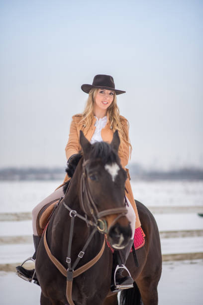 istock Woman enjoying winter breaks with her horse 641483890
