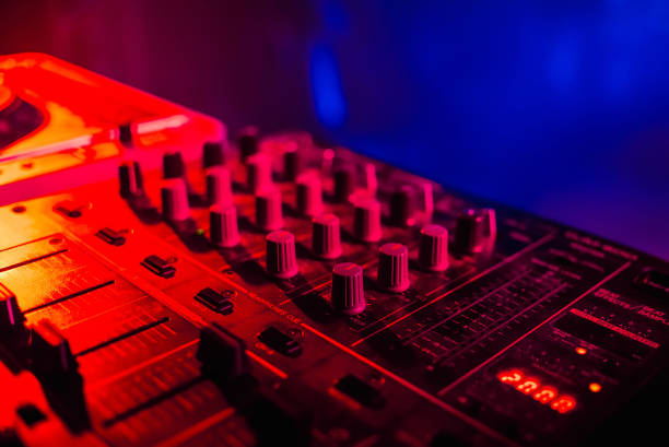 istock DJ mixer closeup with colored bright background r 641484050