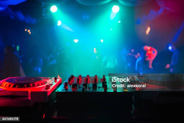 Mixer And A Dj Booth In The Nightclub At A Party With A Diffuse Bright Background Stock Photo - Download Image Now