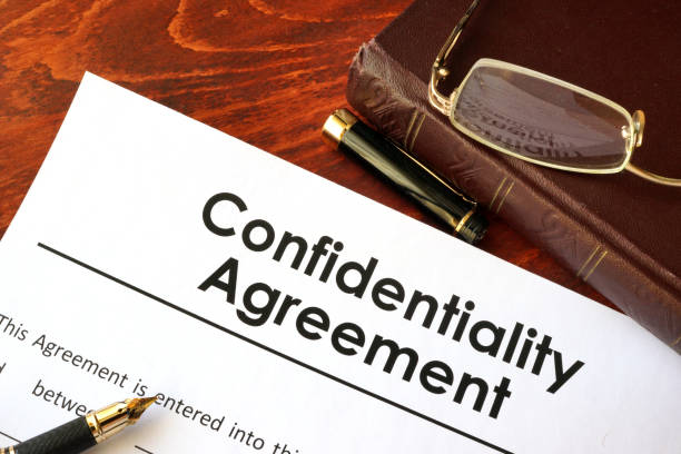 istock Confidentiality Agreement form on a table. Non-disclosure contract. 641488112