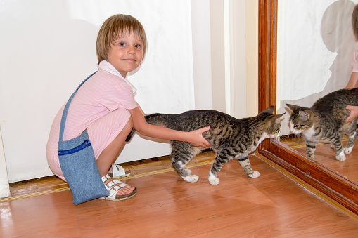 Young Girl with her Cat .