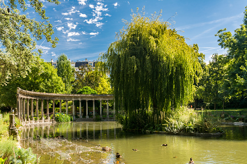 Paris, France - August 14, 2016: Parc Monceau is a public park situated in the 8th arrondissement of Paris. At the main entrance is a rotunda. The park covers an area of 8.2 hectares.