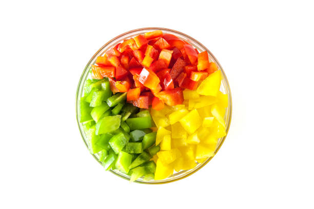 istock Diced Red, Green & Yellow Pepper together in white bowl 641496058