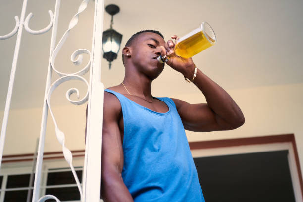 istock Lonely Unemployed Black Man Drinking Alcohol At Home 641496258