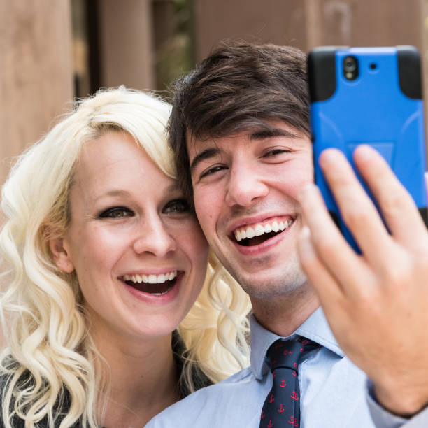 istock young couple taking a selfie 641499966
