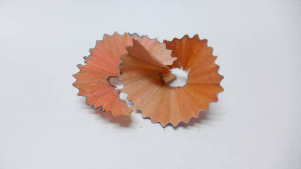 istock isolated wood chips from the pencil sharpener.on white background 641500488