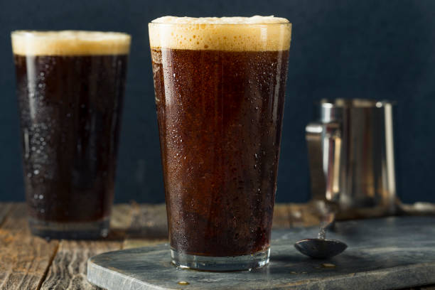 Frothy Nitro Cold Brew Coffee Frothy Nitro Cold Brew Coffee Ready to Drink nitrogen stock pictures, royalty-free photos & images