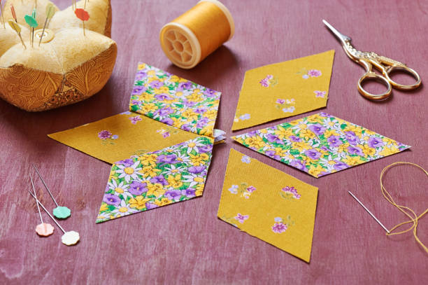 istock Sewing of  element quilt in progress, prepared cut pieces around accessories 641502138