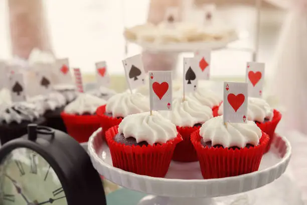 Red velvet cupcakes with playing cards toppers, Alice in wonderland tea party, toning