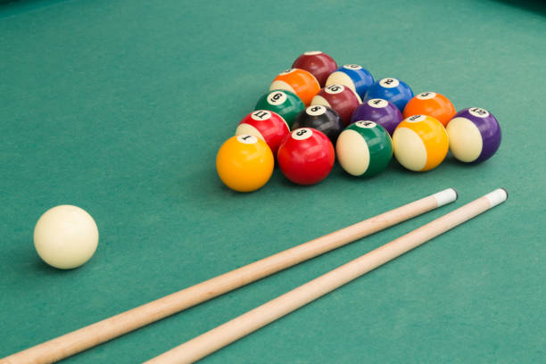 istock Snooker billards pool balls and cue stick on green table 641502756