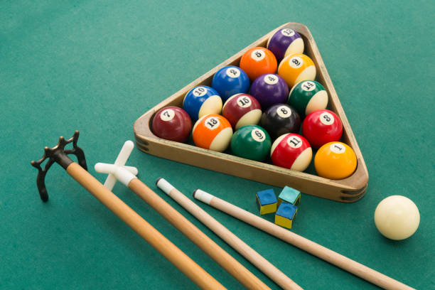 istock Snooker billards pool balls, cue, chalk on green table 641503536