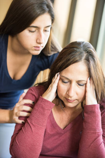 istock Hispanic young woman comforting her mother 641508092