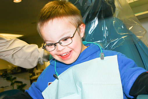 Cute Young Boy With Downs Syndrome at the Dentist