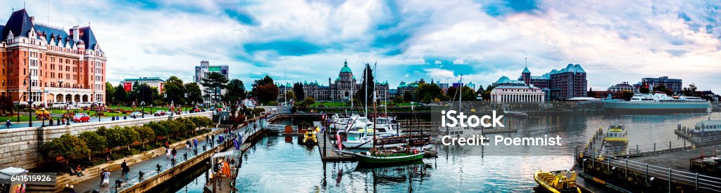 Wonderful summer evening in Victoria inner harbour, BC Canada. The Victoria Inner Harbour is one of a very beautiful harbours in the world. The Victoria Inner Harbour has lot of  long history and small and recreational vessels and tall ships can moor there.  BC Stock Photo