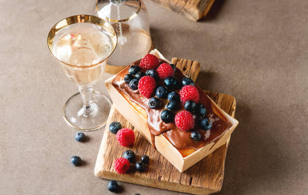 istock Christmas cake with chocolate frosting, blueberries and raspberr 641516982