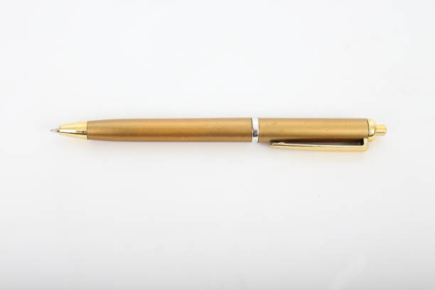 istock Golden pen on a white background. 641520804