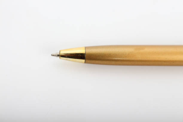 istock Golden pen on a white background. 641520836