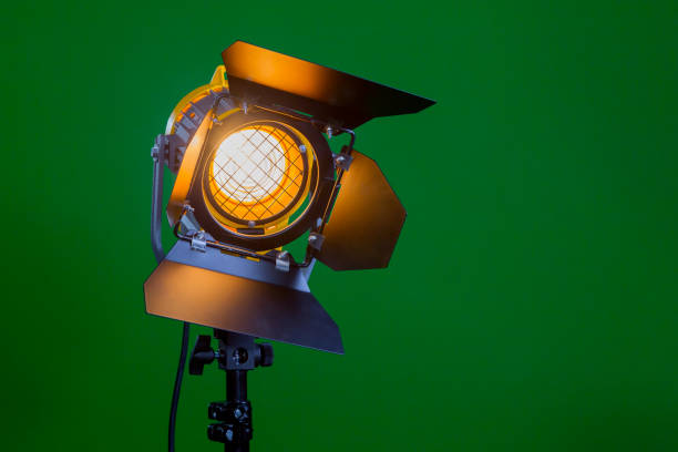istock Halogen spotlight with a Fresnel lens on green background close-up 641521904