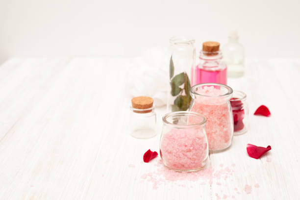 istock salt, rose water from rose petals on a white 641524038