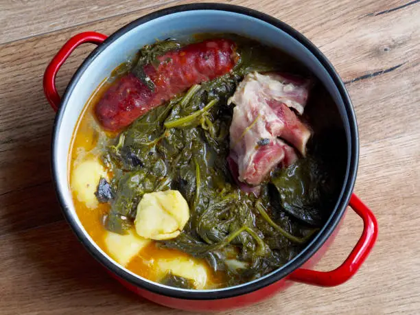 Galician cooked in saucepan on table