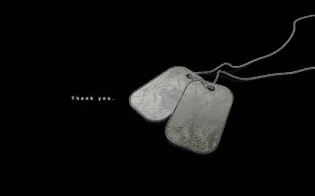Photo of Thank You Veterans Day Old Dog Tags Chain on Black Background