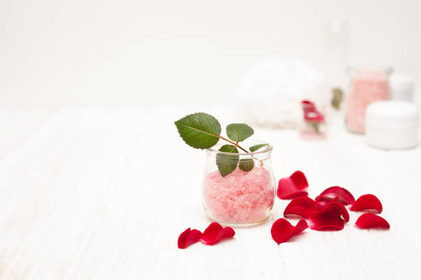 istock salt, rose water from rose petals on a white 641524362