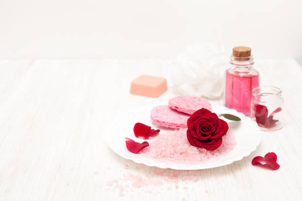 istock salt, rose water from rose petals on a white 641524402