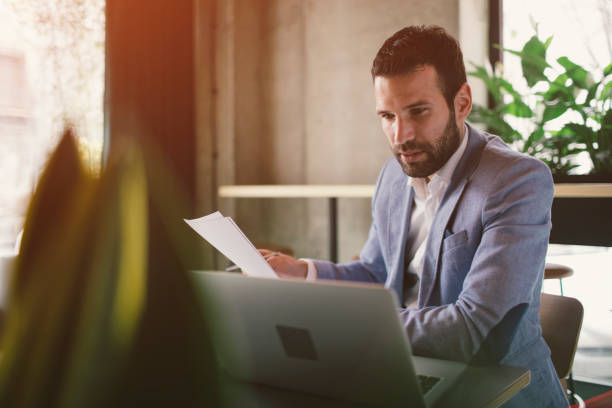 istock Businessman working in cafe 641528230