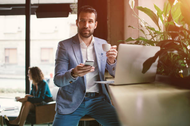 istock Businessman using smart phone in cafe 641528872