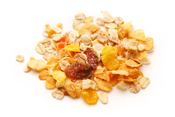 Heap of fresh musli with raisin on white background