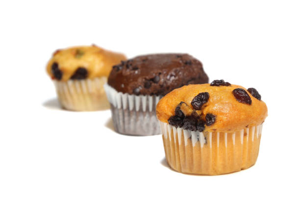 istock Three muffins on white background. Homemade bakery, sweet, food. 641529500