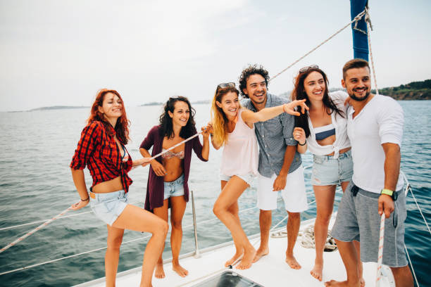 istock Happy friends on a yacht 641530338