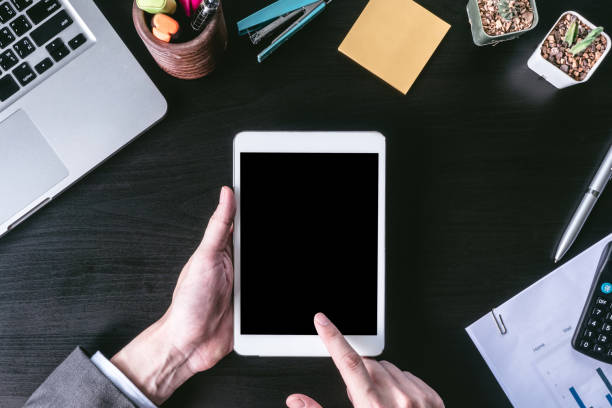 istock Top view of Businessman using tablet on the office desk. 641532342