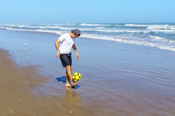 soccer ball floating in ocean water