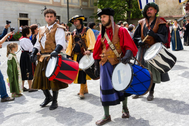 Cesky Krumlov, Czech Republic - June 22, 2014: Drummers dressed in historical costumes are walking in Krumlov streets during annual Five-Petalled Rose Celebrations.