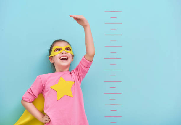 istock child plays superhero 641534960