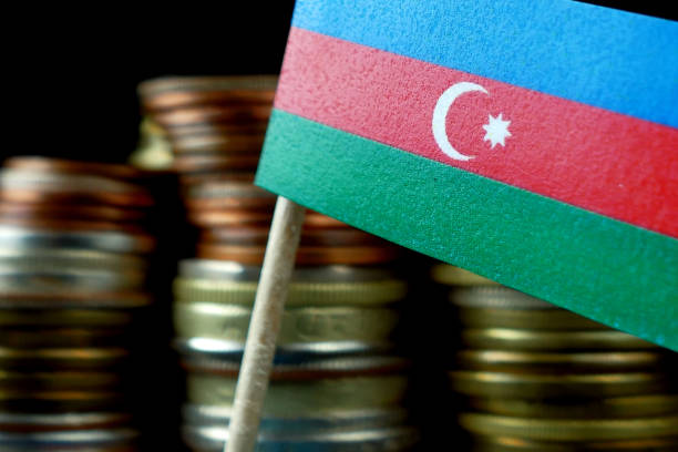 istock Azerbaijani flag waving with stack of money coins macro 641536672