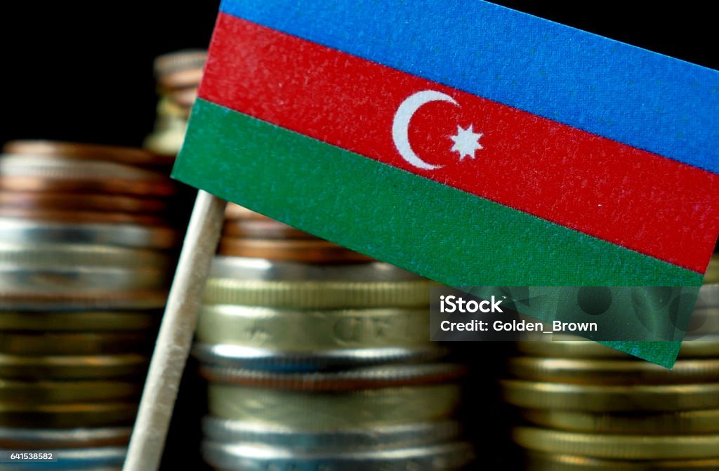 Azerbaijani flag waving with stack of money coins macro Assistance Stock Photo