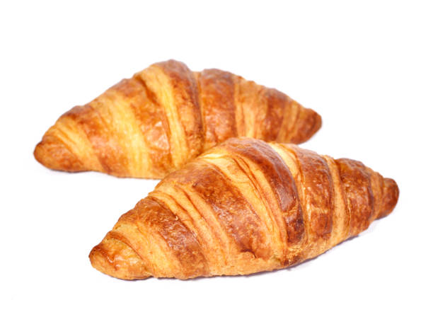 istock Two crispy croissants, isolated on white background 641538702