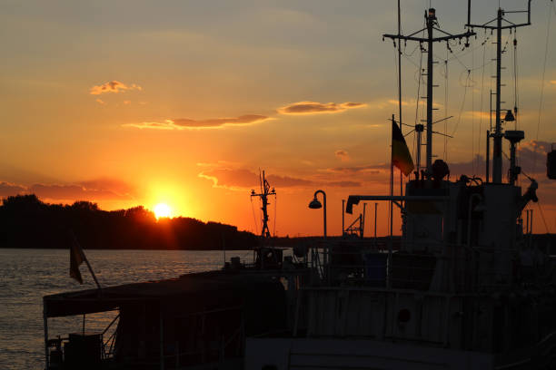 istock Silhouette of ship, mast in Danube river at sunset 641541270
