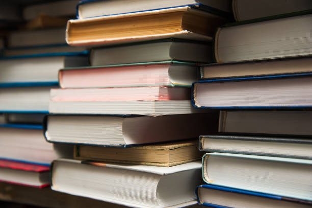 istock Old books on book shelf background 641542358