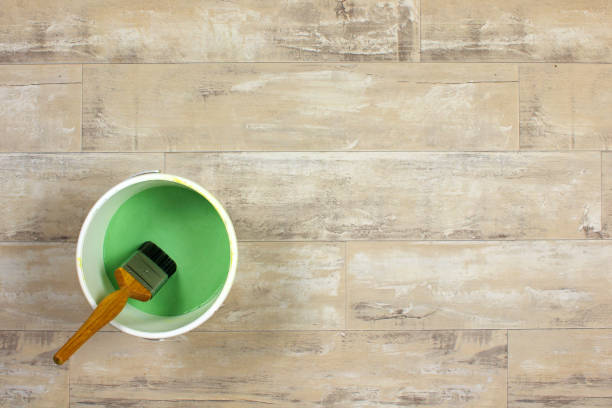 istock Paintbrush in a pot of green paint 641543346